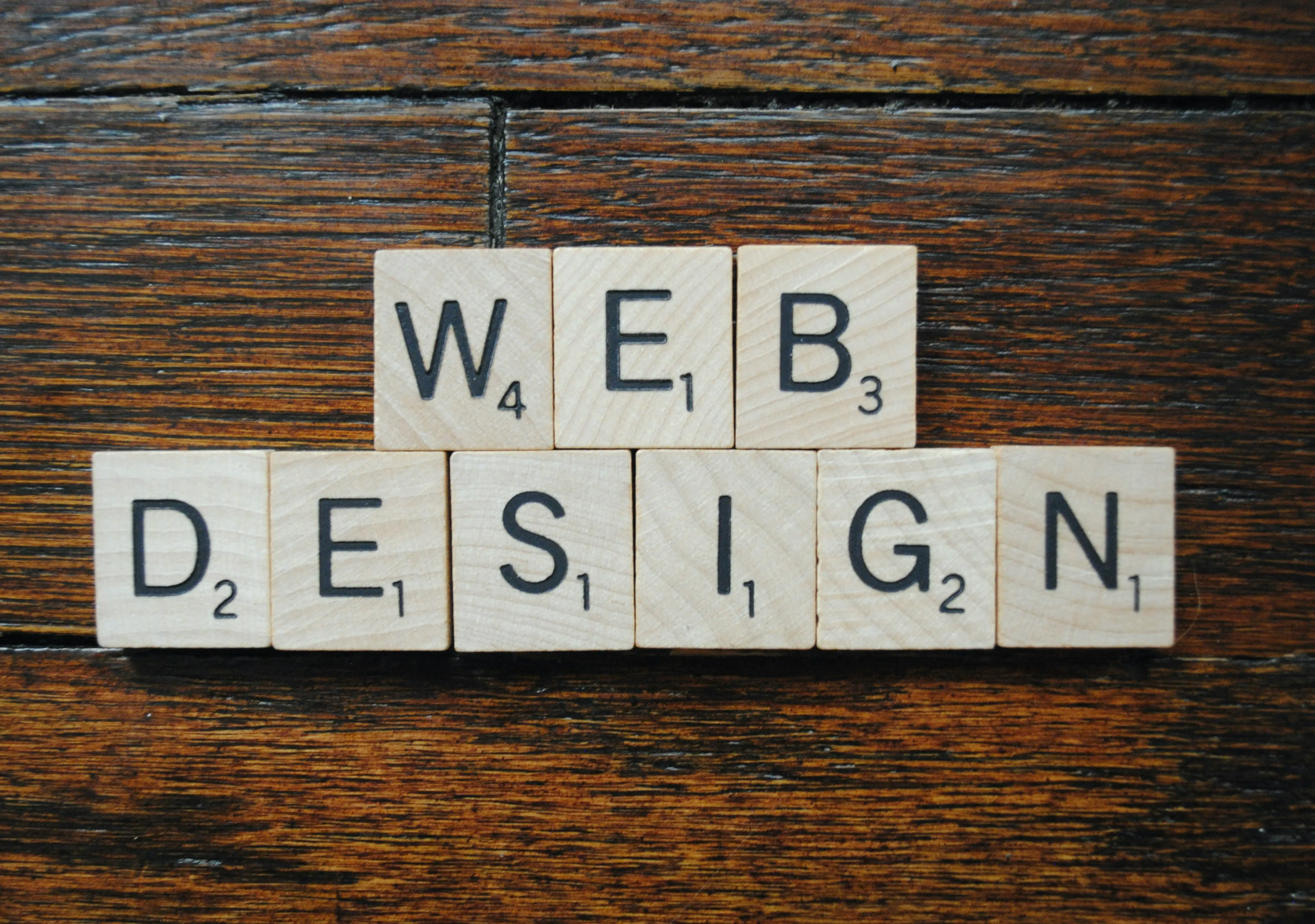 Scrabble tiles spelling 'WEB DESIGN.