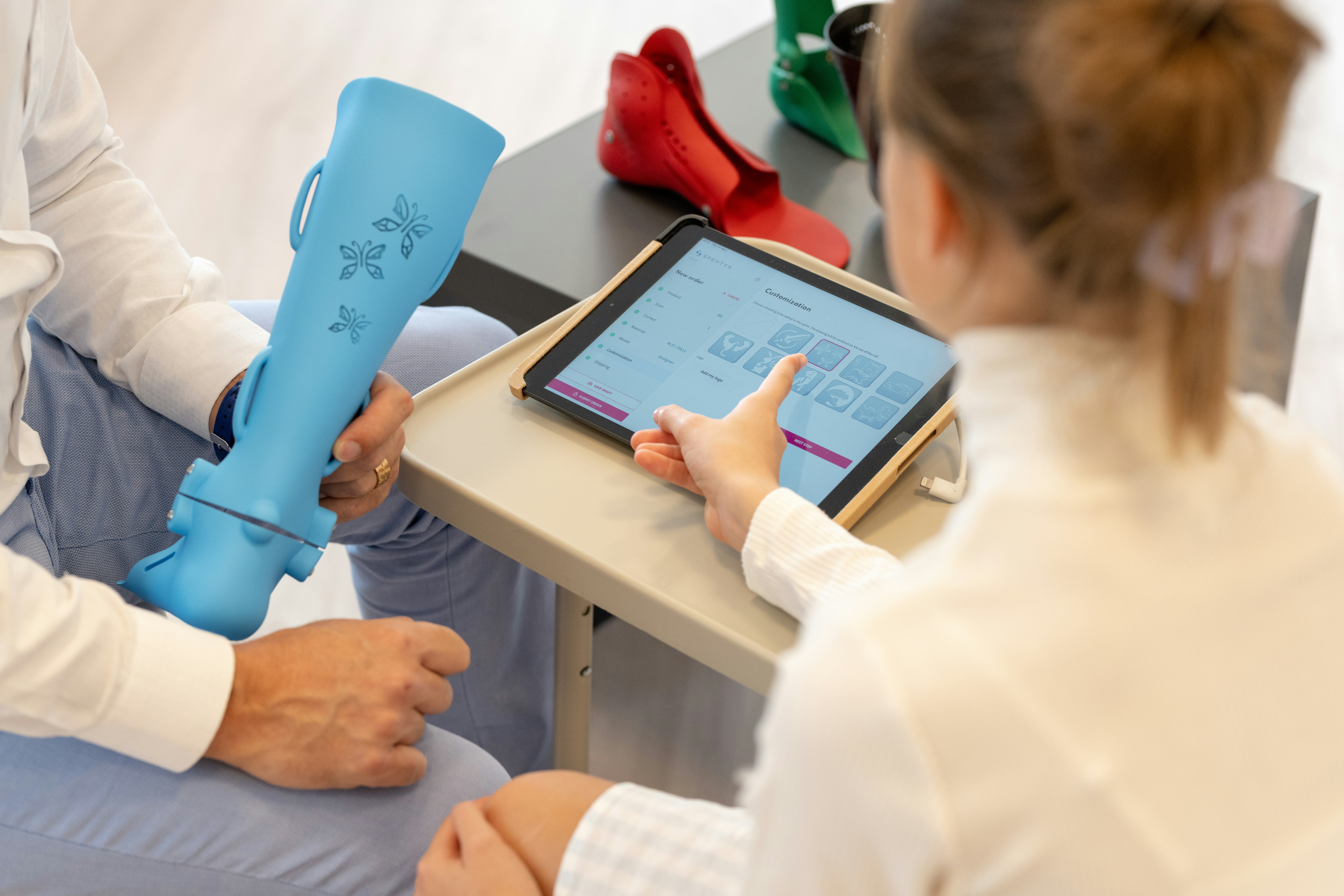 A woman explaining medical device to a person