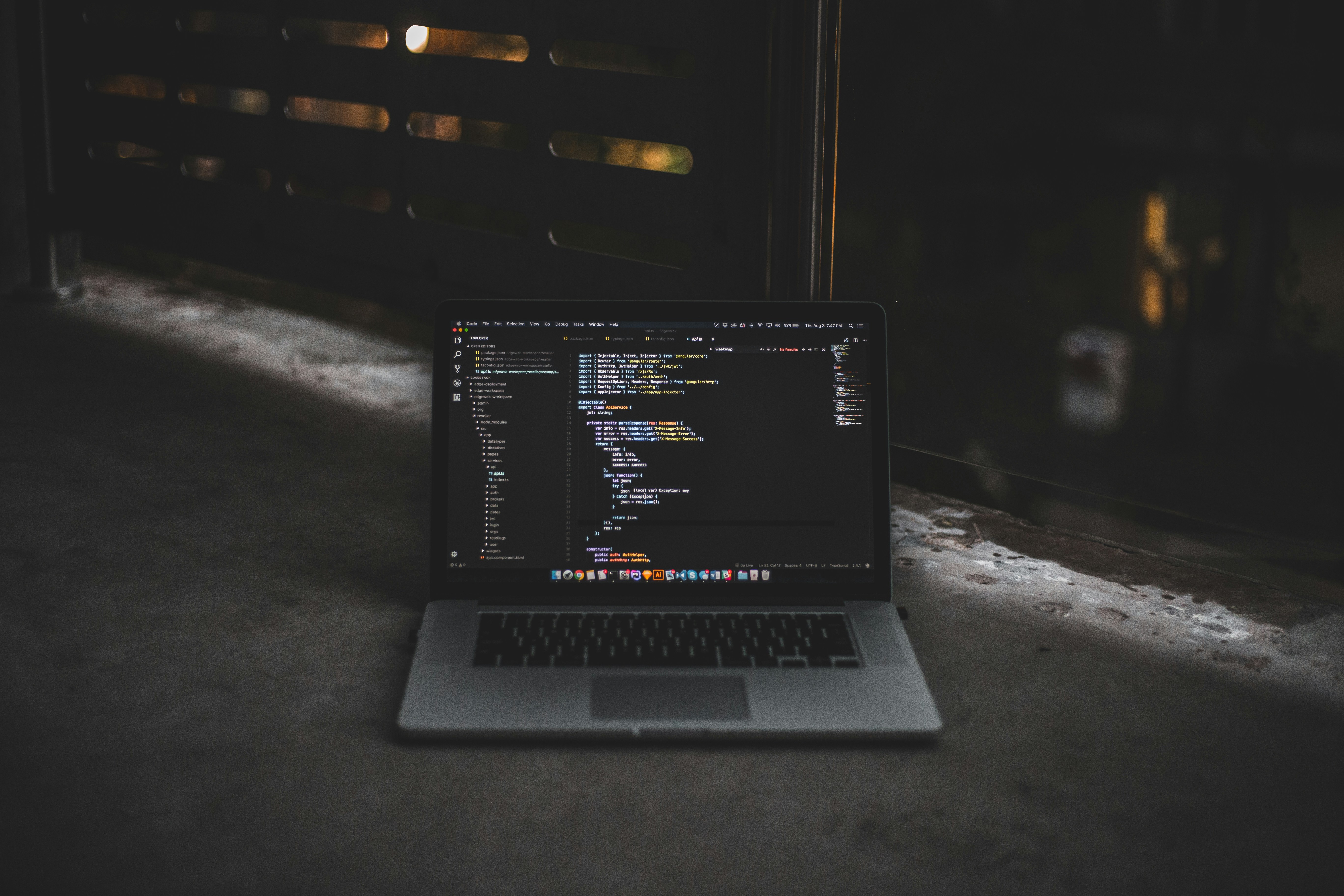 Laptop with dark-themed code editor